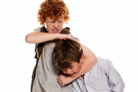 Boy (6-8) being bullied by older boy (9-11)