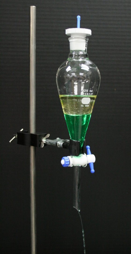 Separatory funnel with oil and colored water
