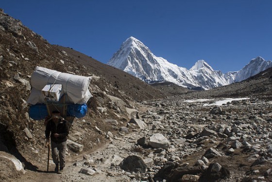 640px-Sherpa_Hikes_from_Dughla_Towards_Lobuche